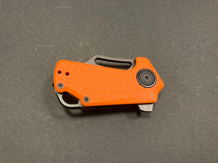 MICRO COLTELLO A LAMA PIEGHEVOLE PUCK CON IMPUGNATURA G10 ARANCIONE BLACK FOX